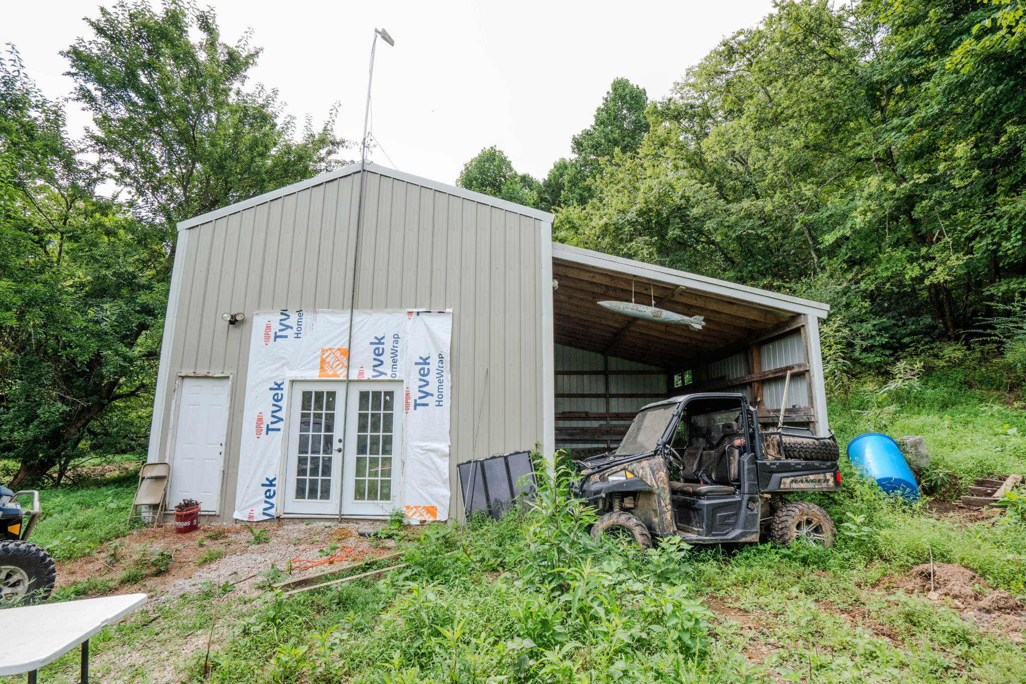 3264 Martin Hollow Road Culleoka, TN 38451 - Photo 52 of 68 a backyard of a house with table and chairs