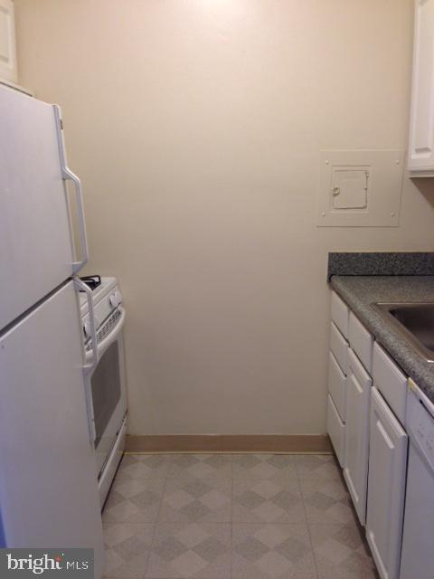 2030 F Street Northwest, Unit 809 Washington, DC 20006 - Photo 4 of 6 a view of storage and utility room with washer and dryer