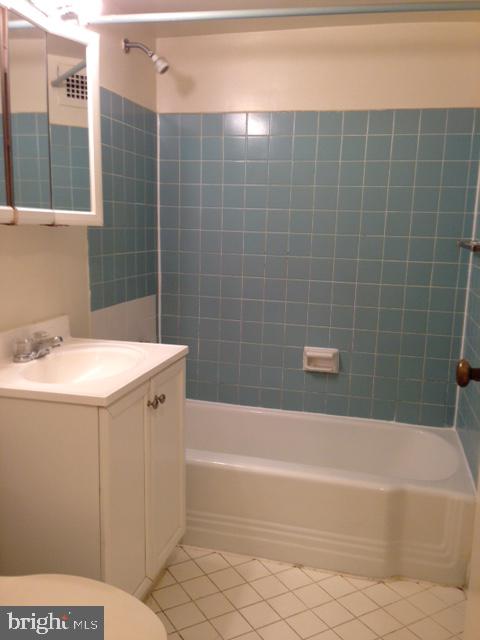2030 F Street Northwest, Unit 809 Washington, DC 20006 - Photo 6 of 6 a bathroom with a sink a toilet and bathtub