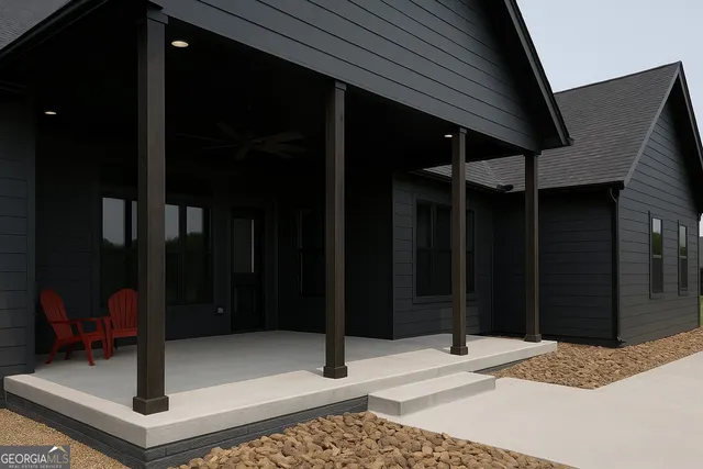 a view of swimming pool with an outdoor seating