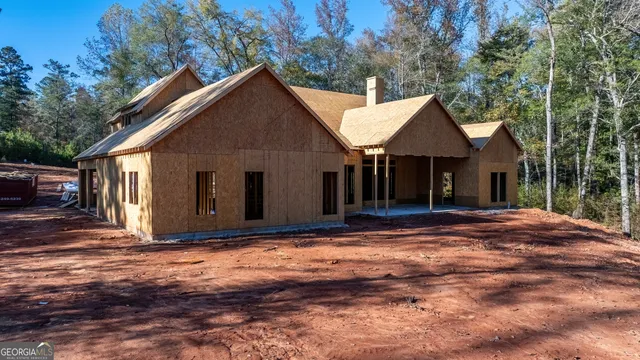 a view of a city with lush green forest