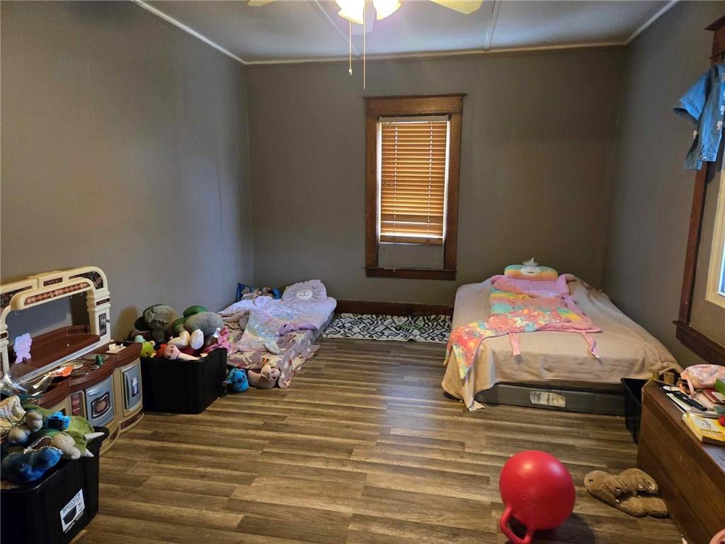 104 Forrest Street Petrolia, PA 16050 - Photo 7 of 22 a bedroom with a bed and wooden floor