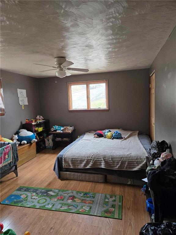 104 Forrest Street Petrolia, PA 16050 - Photo 8 of 22 a bedroom with bed and window