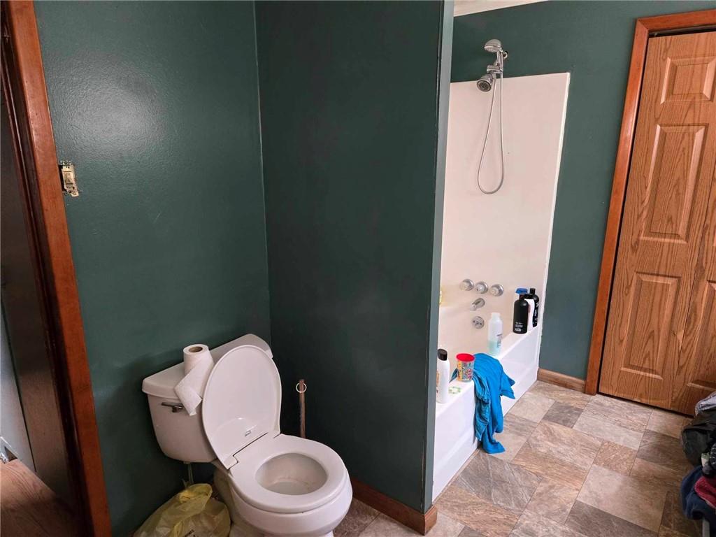 104 Forrest Street Petrolia, PA 16050 - Photo 10 of 22 a bathroom with a toilet and shower