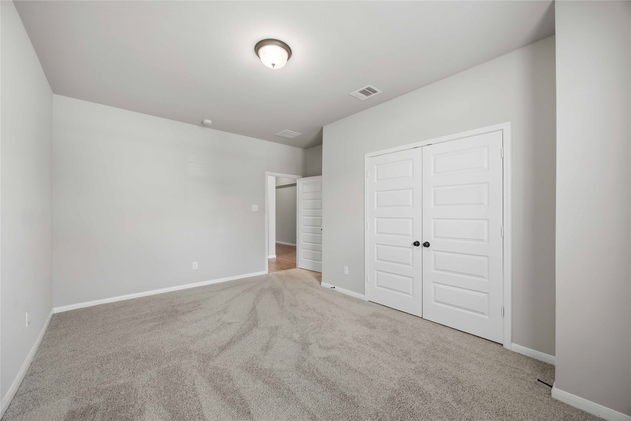 2808 Bisbee Road League City, TX 77573 - Photo 5 of 42 Bedroom 2- Grey Carpet & Black Finishes