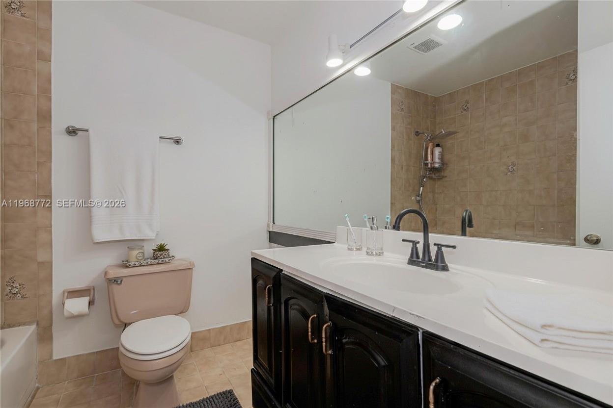 1082 West 79th Street, Unit 25 Hialeah, FL 33014 - Photo 15 of 16 a bathroom with a sink and a toilet
