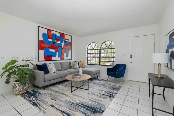 a living room with furniture and a window