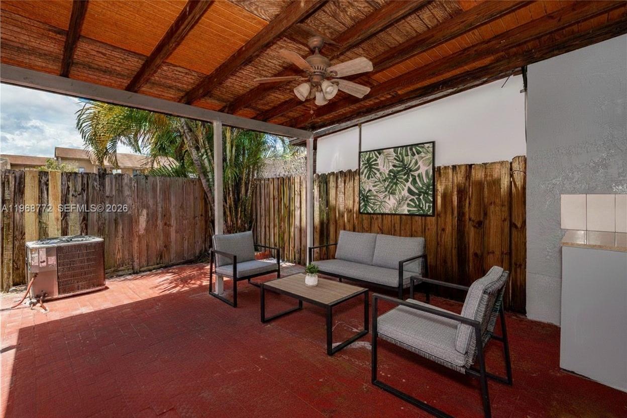 1082 West 79th Street, Unit 25 Hialeah, FL 33014 - Photo 6 of 16 a building outdoor space with patio furniture