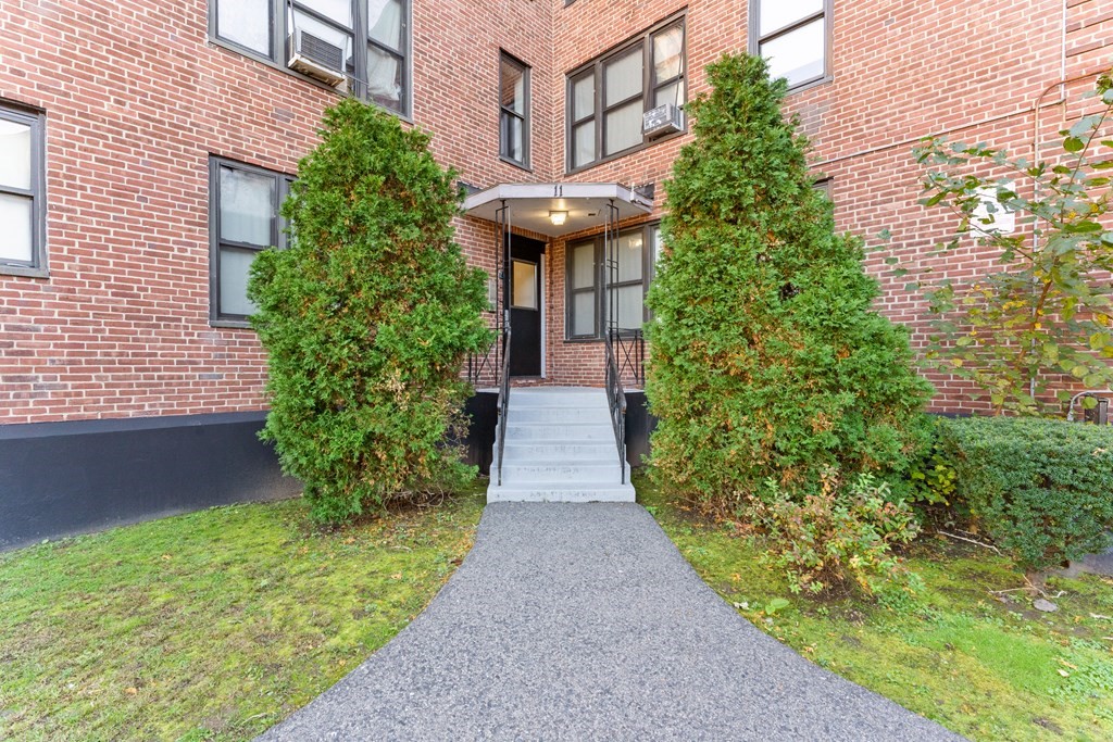 11 Victory Road, Unit 32 Boston, MA 02122 - Photo 15 of 16 a view of a pathway with plants