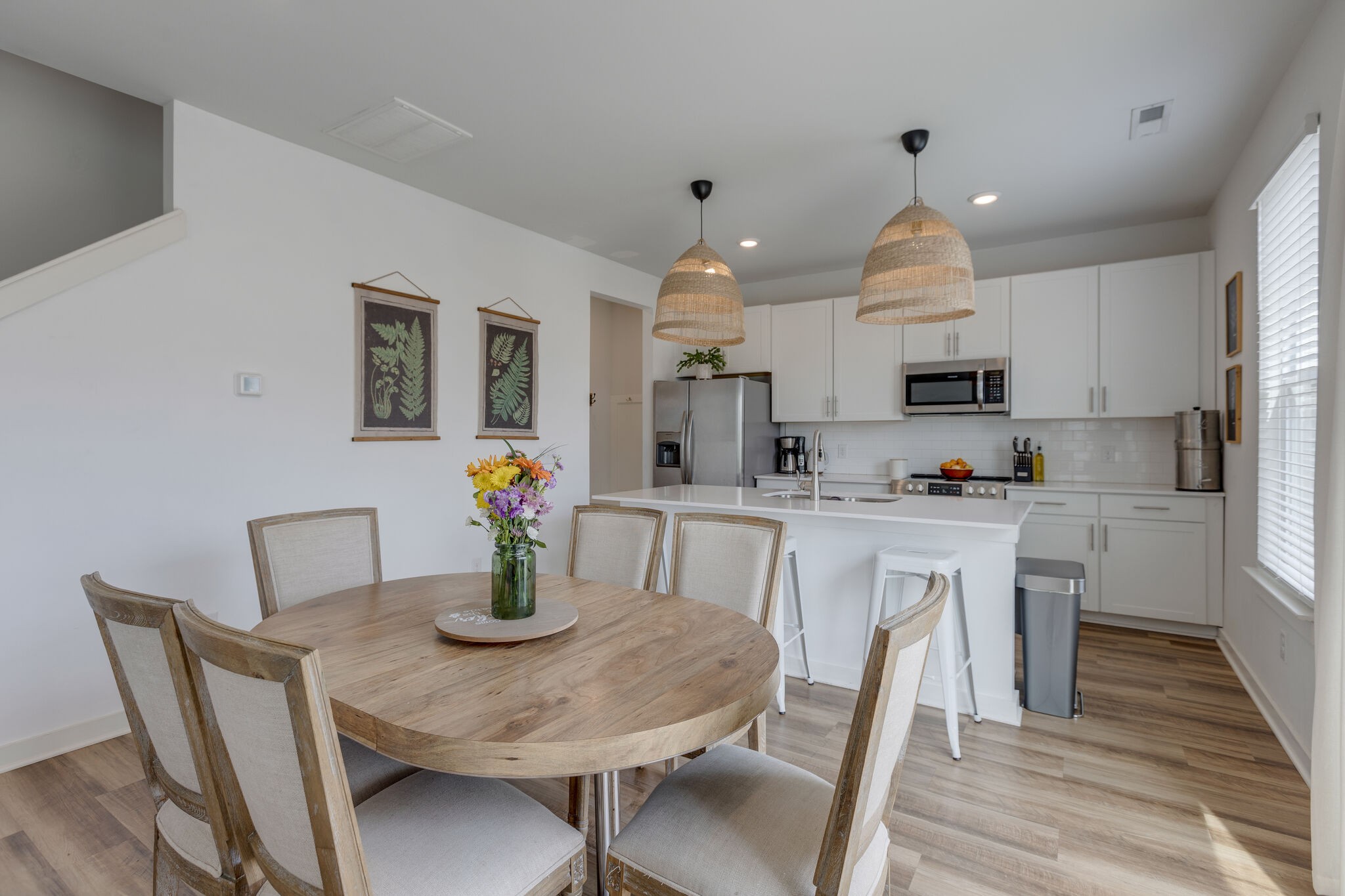 409 Irwin Way Spring Hill, TN 37174 - Photo 13 of 32 a kitchen with stainless steel appliances granite countertop a sink a stove a dining table and chairs