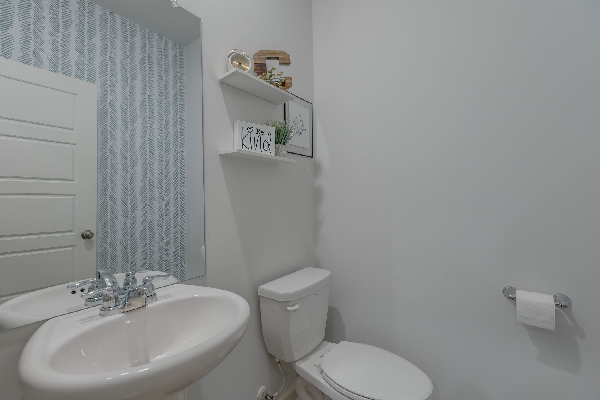 409 Irwin Way Spring Hill, TN 37174 - Photo 19 of 32 a bathroom with a toilet a sink and mirror