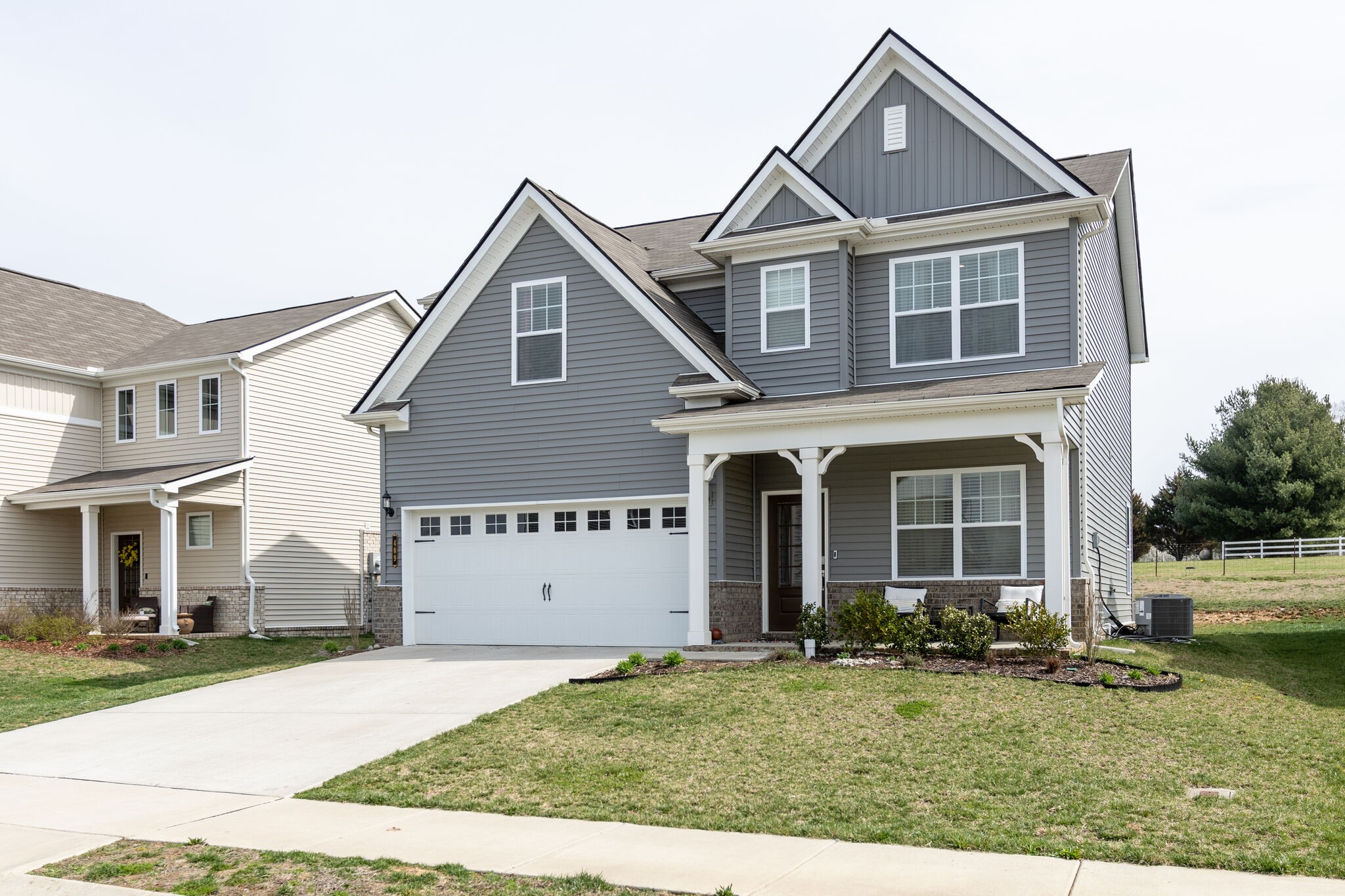 409 Irwin Way Spring Hill, TN 37174 - Photo 2 of 32 a front view of a house with a yard