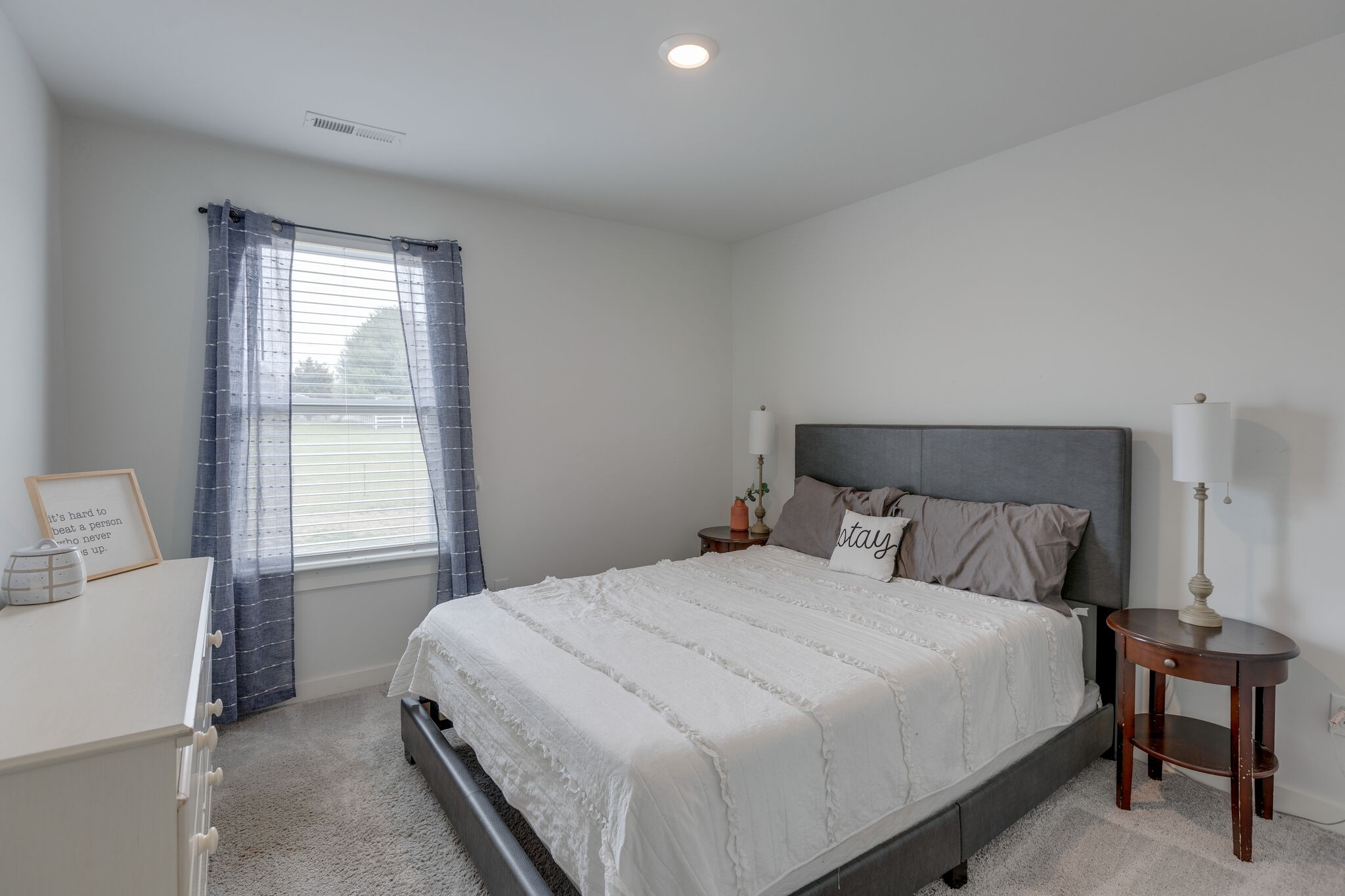 409 Irwin Way Spring Hill, TN 37174 - Photo 23 of 32 a bedroom with a bed and a window