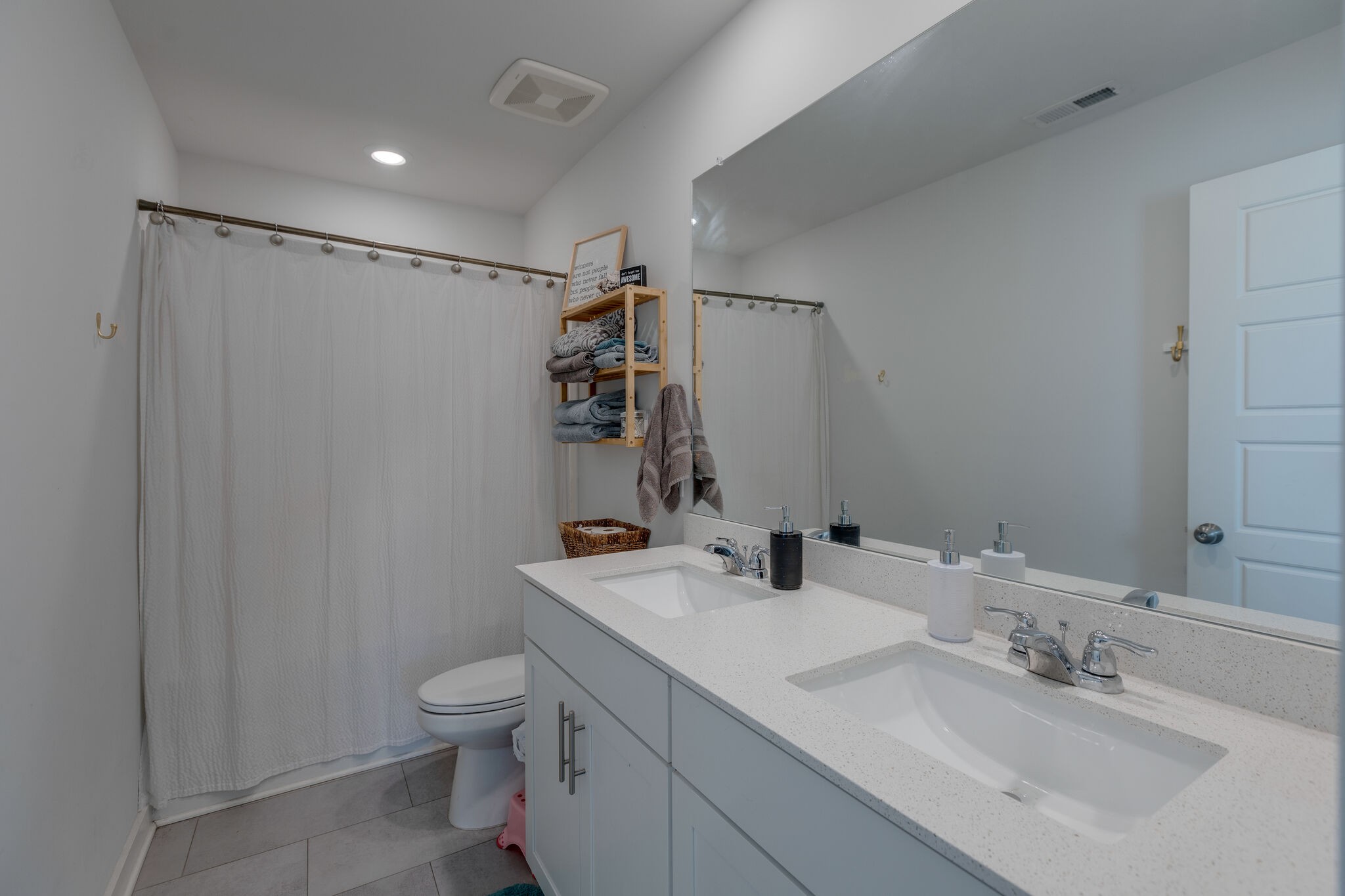 409 Irwin Way Spring Hill, TN 37174 - Photo 25 of 32 a bathroom with a sink toilet and shower