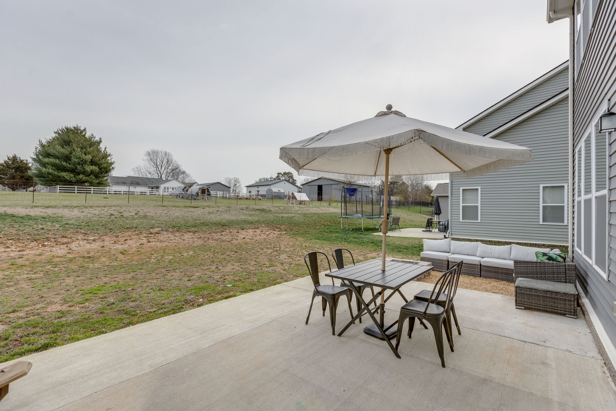 409 Irwin Way Spring Hill, TN 37174 - Photo 27 of 32 a view of a patio with furniture and a lake view