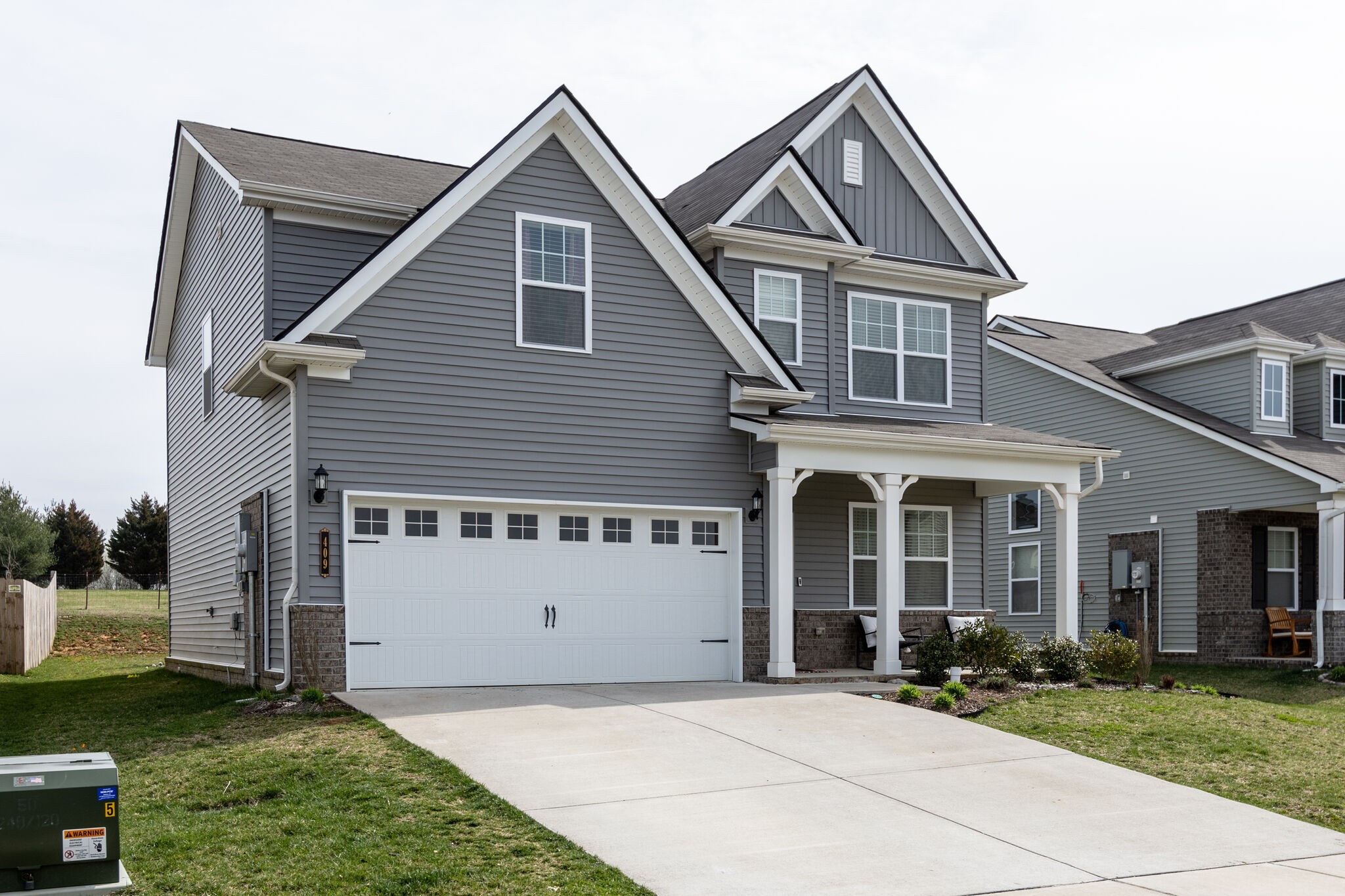 409 Irwin Way Spring Hill, TN 37174 - Photo 3 of 32 a front view of a house with a yard