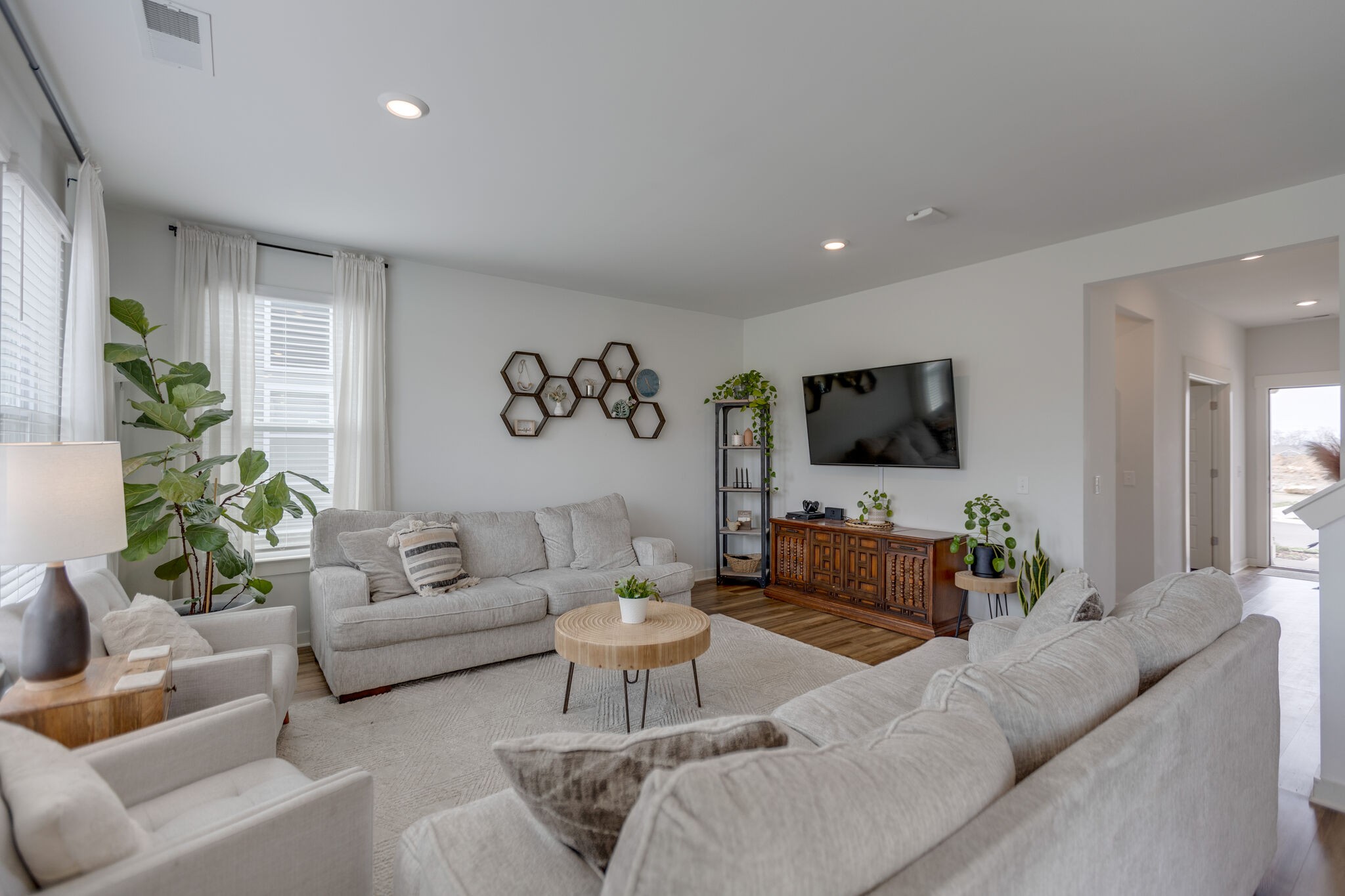 409 Irwin Way Spring Hill, TN 37174 - Photo 9 of 32 a living room with furniture and a flat screen tv
