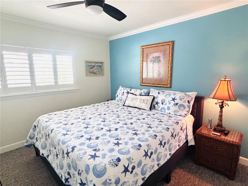 19417 Gulf Boulevard, Unit B209 Indian Rocks Beach, FL 33785 - Photo 11 of 24 a bedroom with bed and window