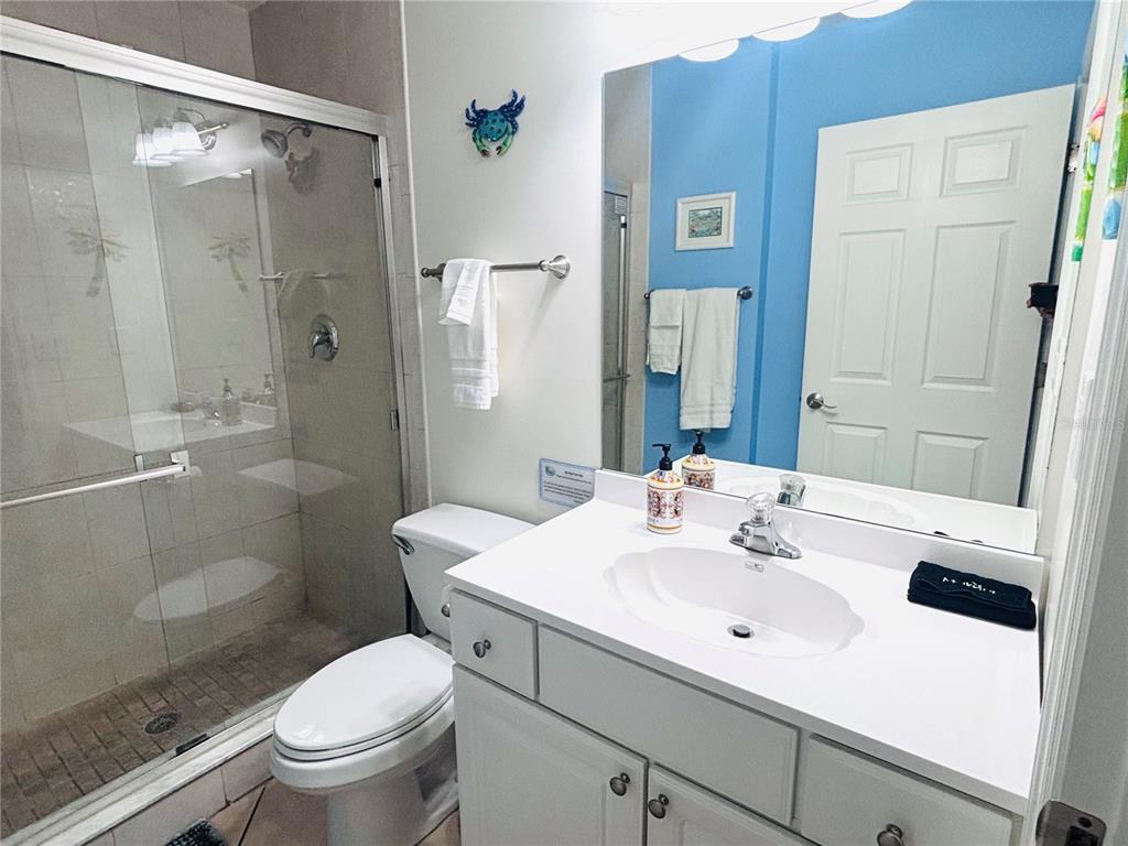 19417 Gulf Boulevard, Unit B209 Indian Rocks Beach, FL 33785 - Photo 12 of 24 a bathroom with a sink toilet and shower