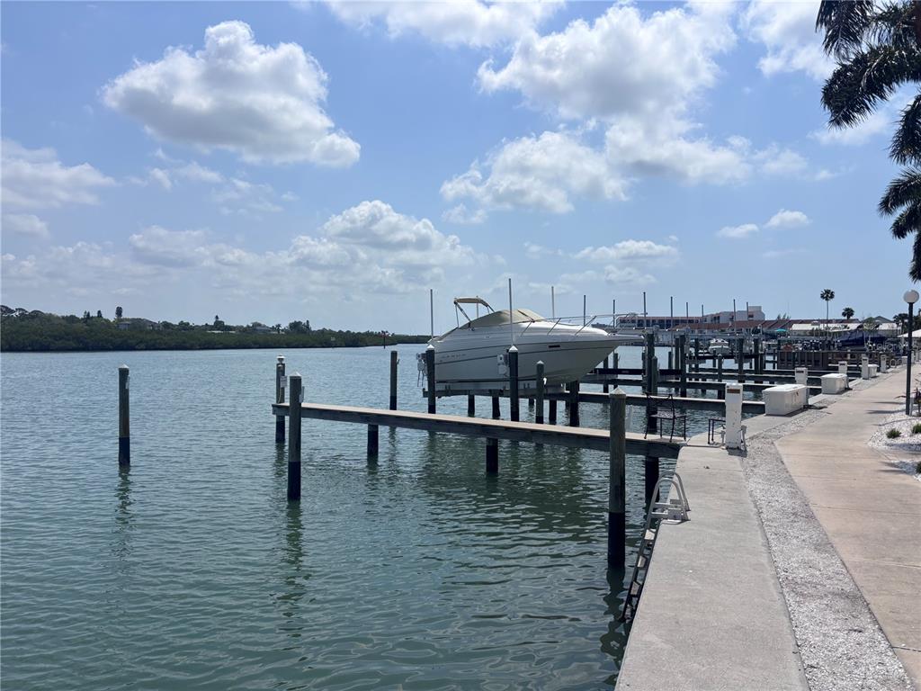 19417 Gulf Boulevard, Unit B209 Indian Rocks Beach, FL 33785 - Photo 20 of 24 a terrace with outdoor seating and lake view
