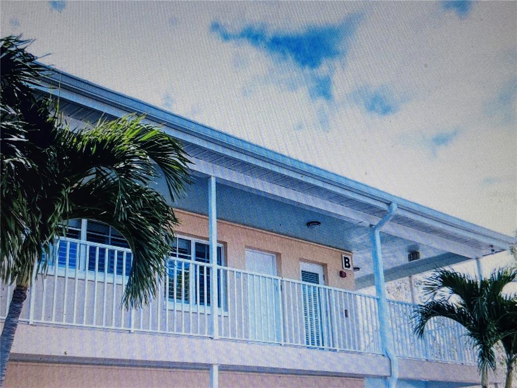 19417 Gulf Boulevard, Unit B209 Indian Rocks Beach, FL 33785 - Photo 2 of 24 a view of balcony with small garden