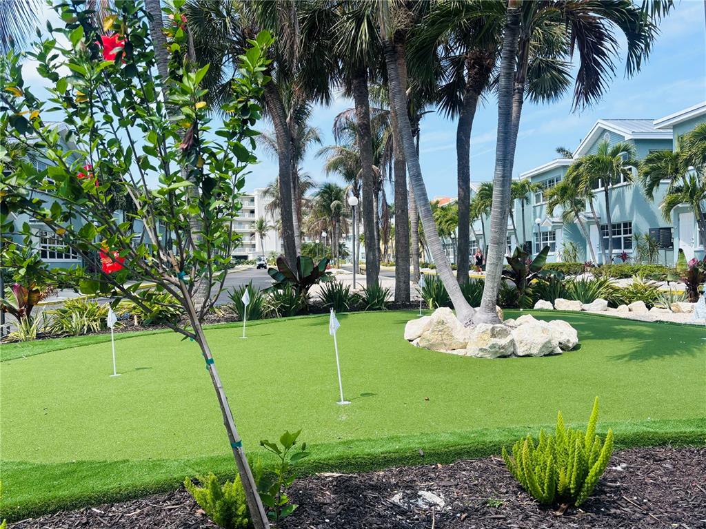 19417 Gulf Boulevard, Unit B209 Indian Rocks Beach, FL 33785 - Photo 22 of 24 a large body of water with a white house