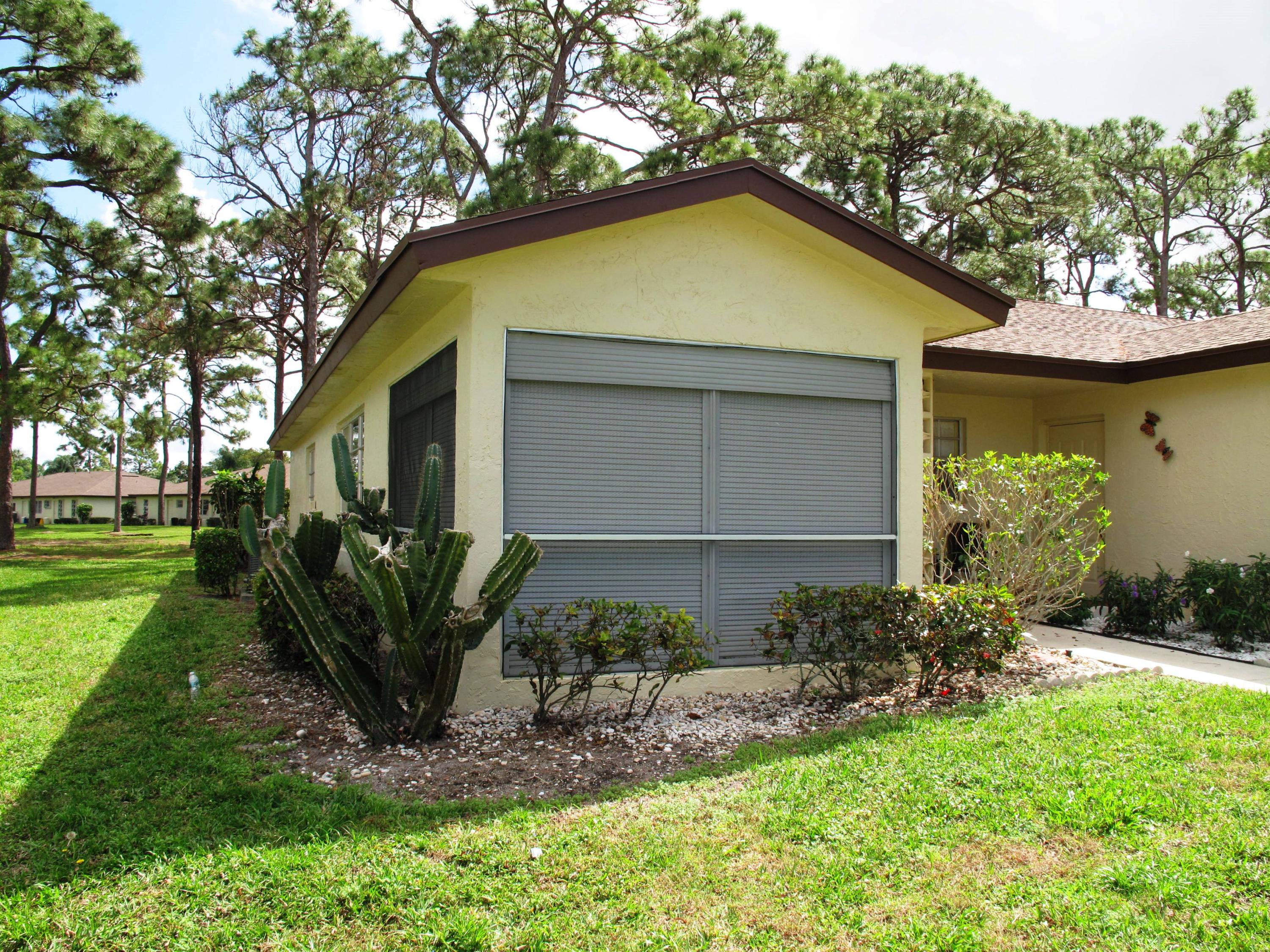 13960 Nesting Way, Unit A Delray Beach, FL 33484 - Photo 1 of 45 Front view of corner villa