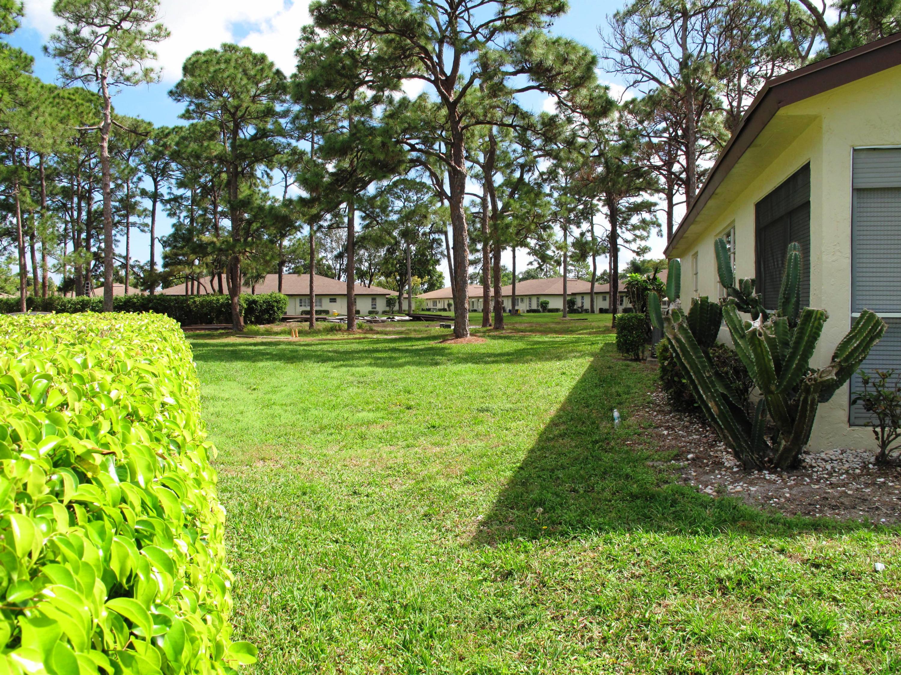 13960 Nesting Way, Unit A Delray Beach, FL 33484 - Photo 32 of 45 side view of villa