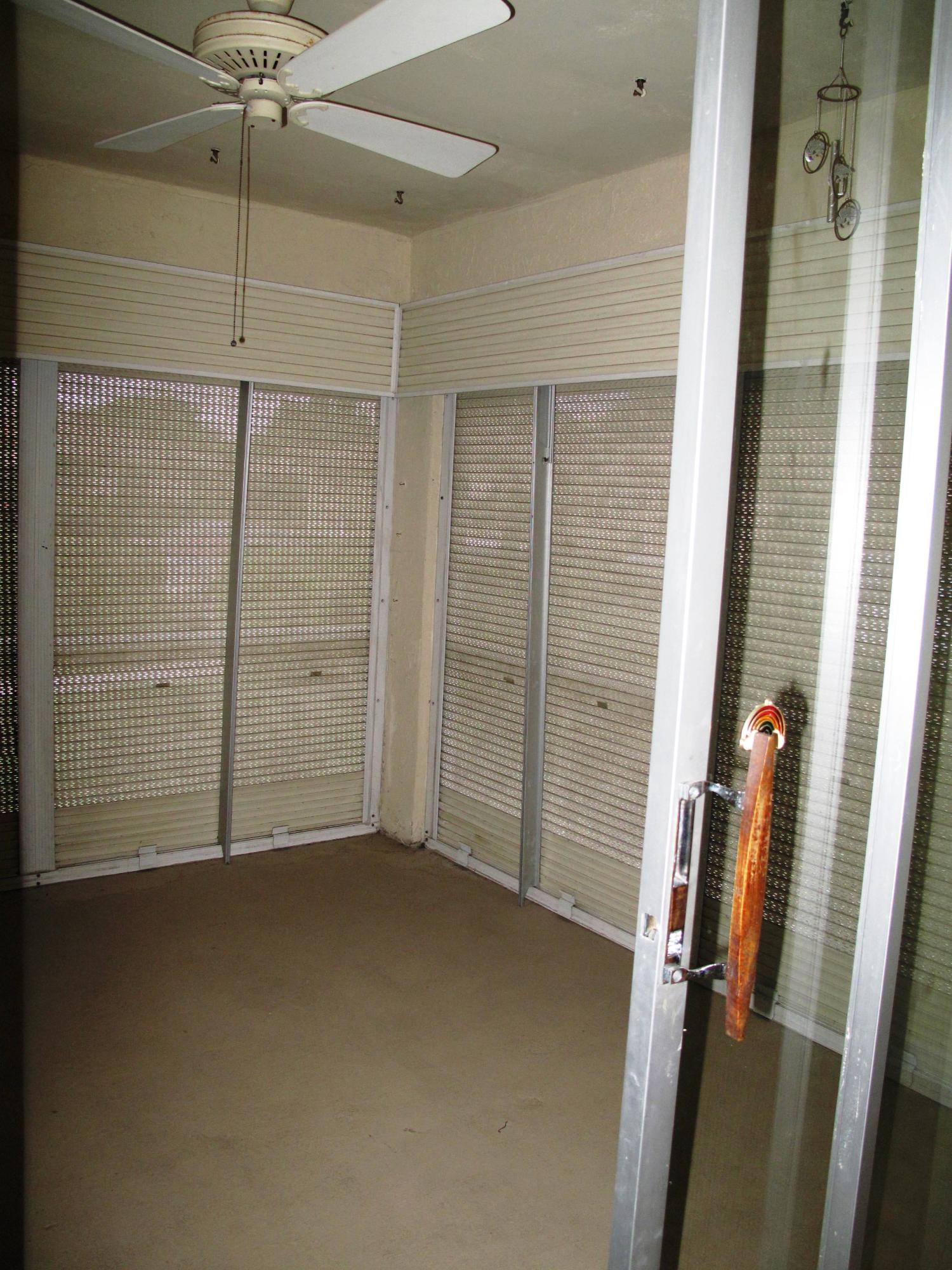 13960 Nesting Way, Unit A Delray Beach, FL 33484 - Photo 4 of 45 Screen and rolldown enclose Florida room