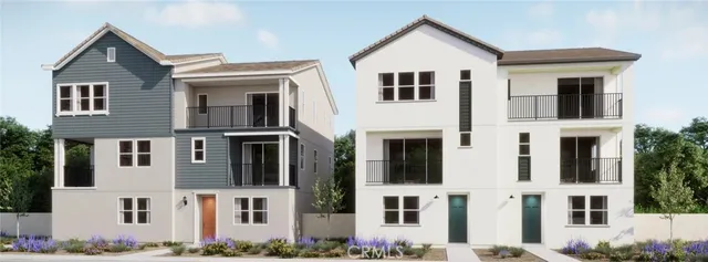 a view of a white building with large windows