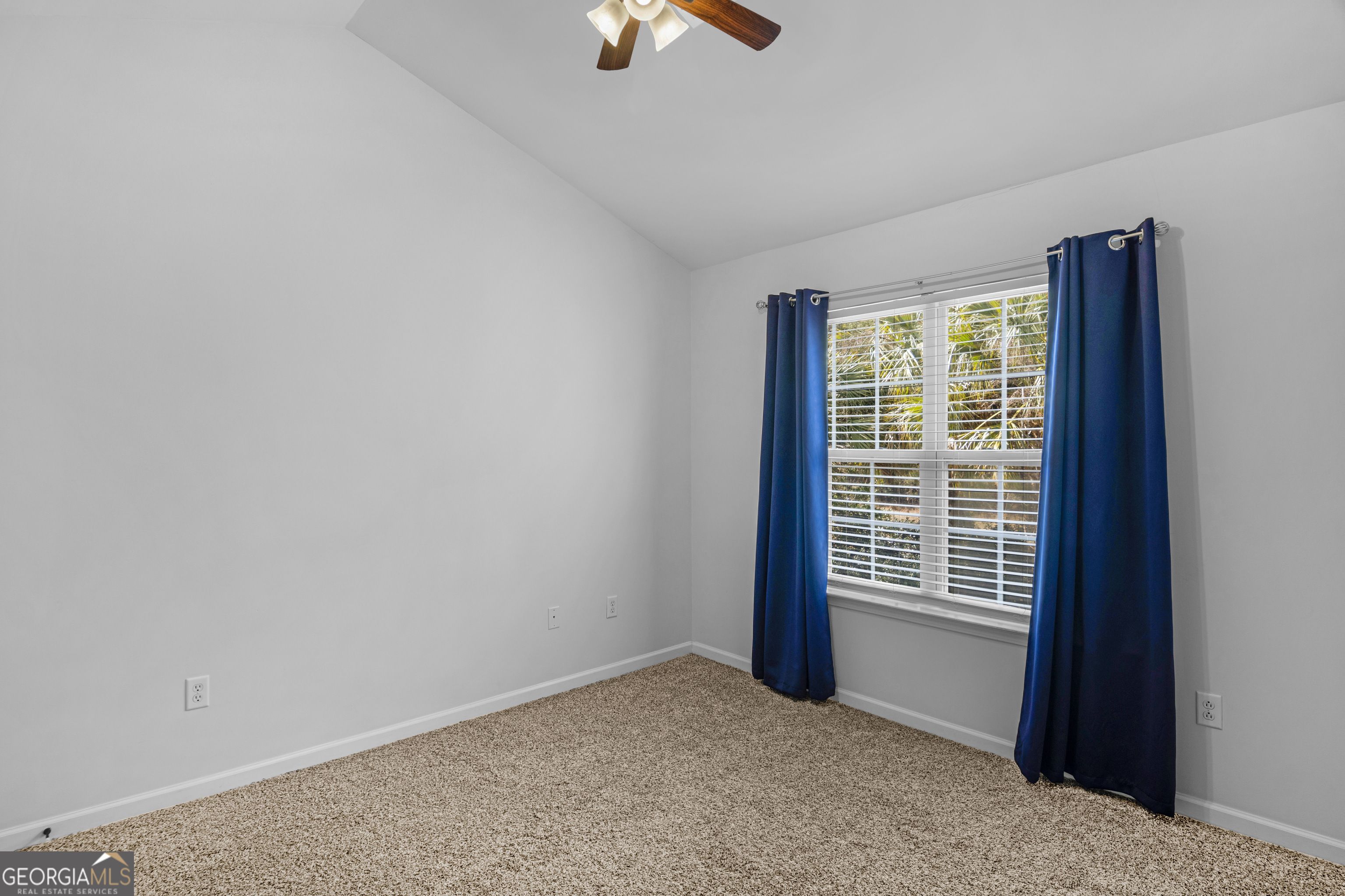 172 Sonata Circle Pooler, GA 31322 - Photo 17 of 48 an empty room with chandelier fan and windows