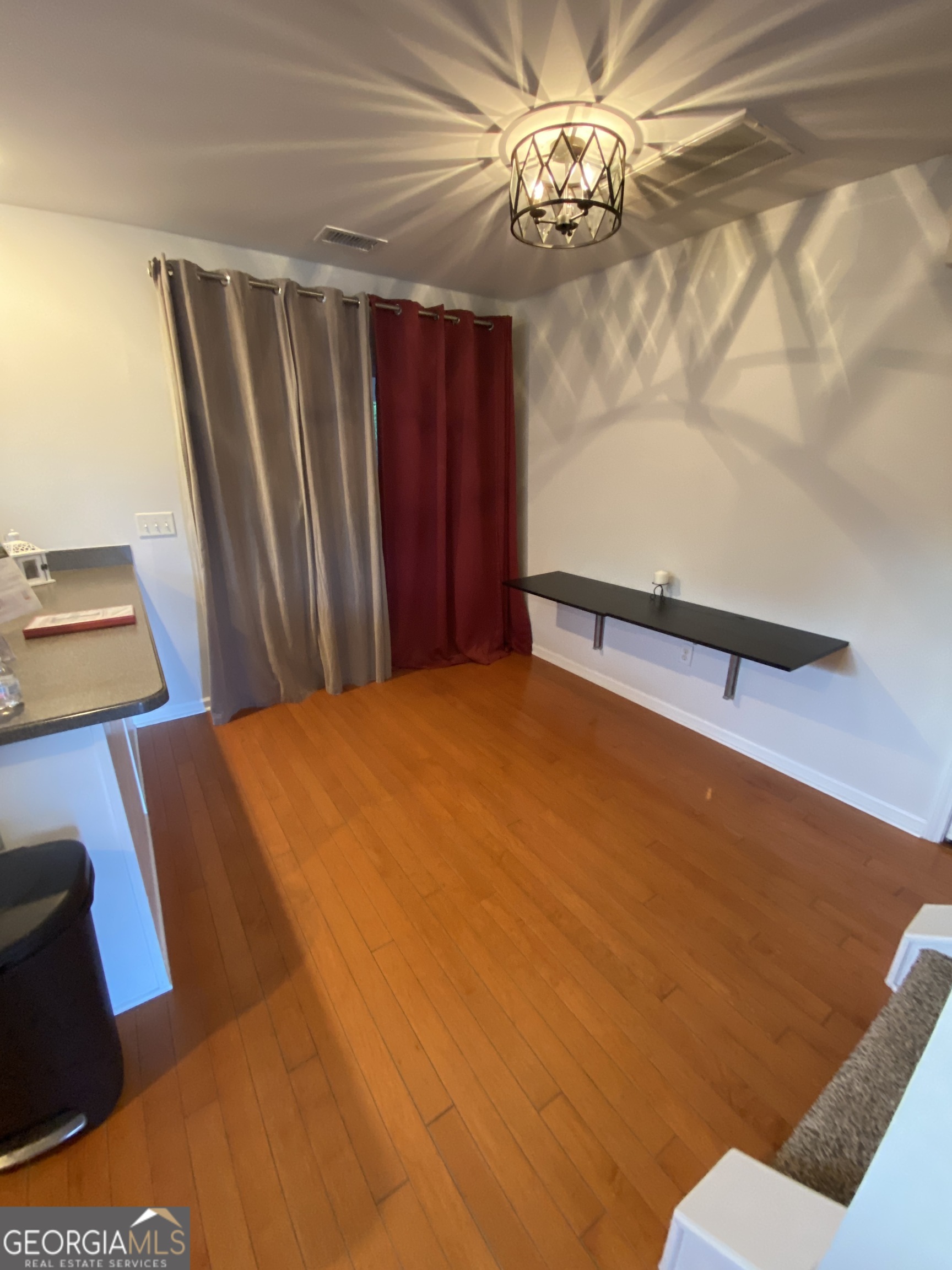 172 Sonata Circle Pooler, GA 31322 - Photo 27 of 48 a bedroom with a bed and a chandelier