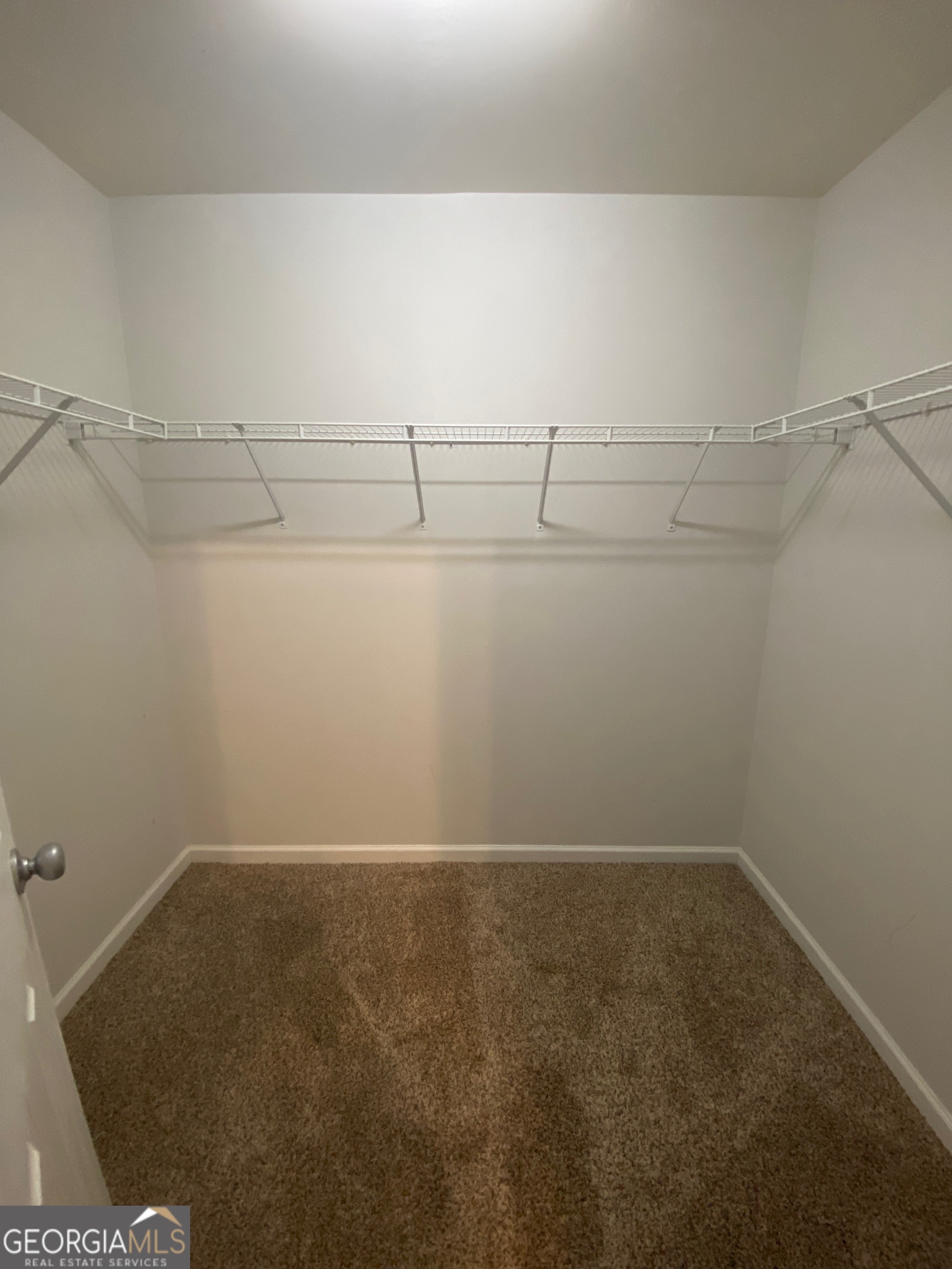 172 Sonata Circle Pooler, GA 31322 - Photo 31 of 48 a view of a room with racks on the wall