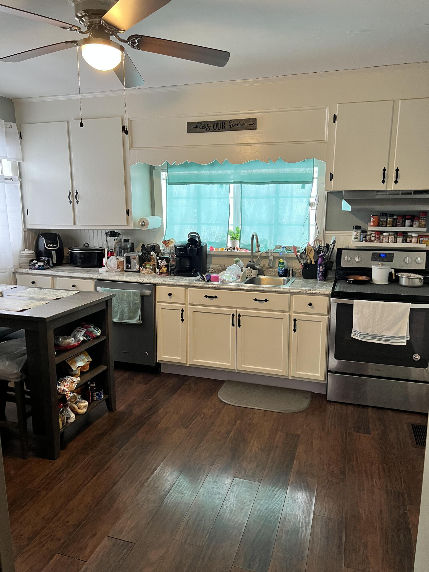 4304 Bandy Road Roanoke, VA 24014 - Photo 6 of 17 a kitchen with a stove a sink and a refrigerator