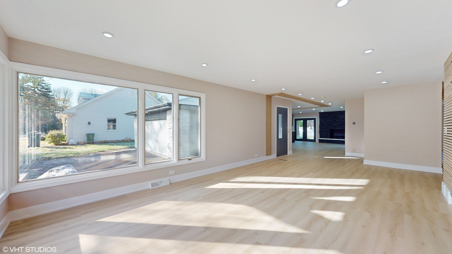 2140 Pfingsten Road Northbrook, IL 60062 - Photo 14 of 44 a view of a hallway with wooden floor and a large window