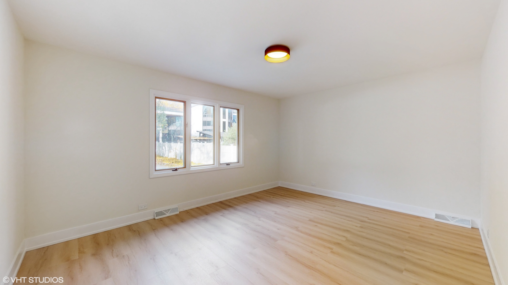 2140 Pfingsten Road Northbrook, IL 60062 - Photo 16 of 44 a view of a room with wooden floor and window