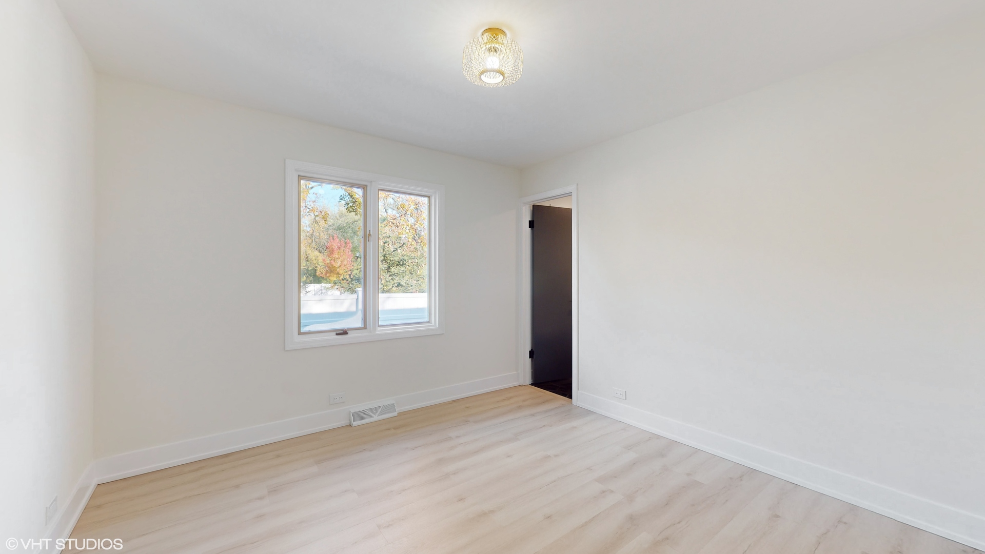 2140 Pfingsten Road Northbrook, IL 60062 - Photo 20 of 44 a view of an empty room with a window