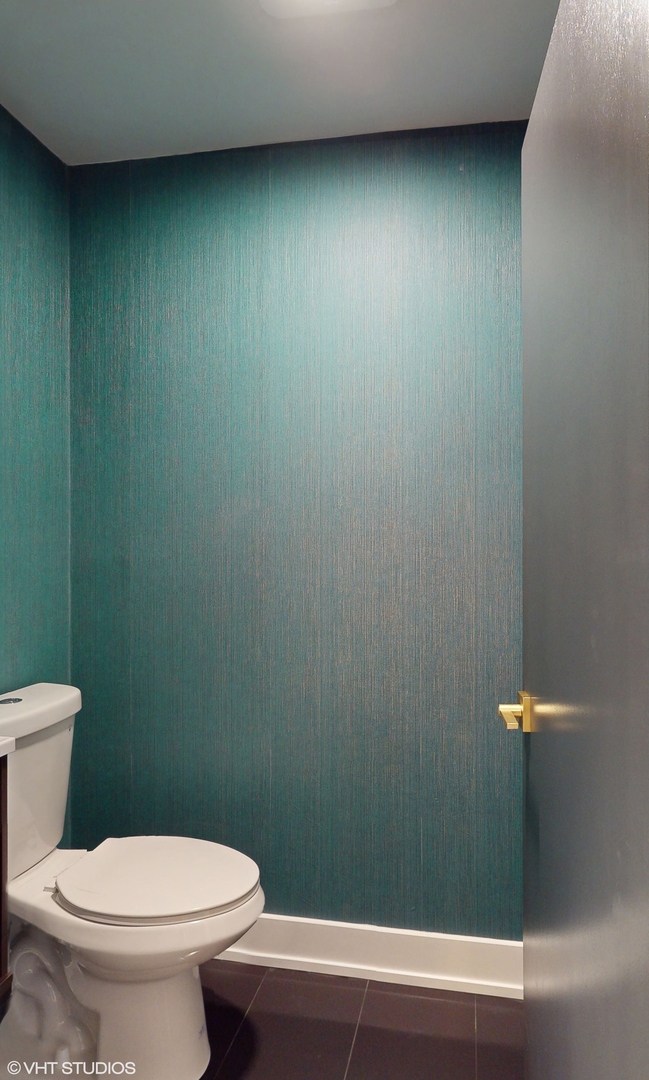 2140 Pfingsten Road Northbrook, IL 60062 - Photo 25 of 44 a bathroom with a toilet and a shower