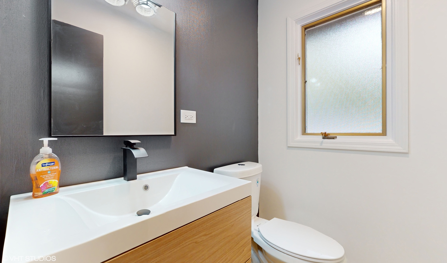2140 Pfingsten Road Northbrook, IL 60062 - Photo 26 of 44 a bathroom with a sink toilet and mirror