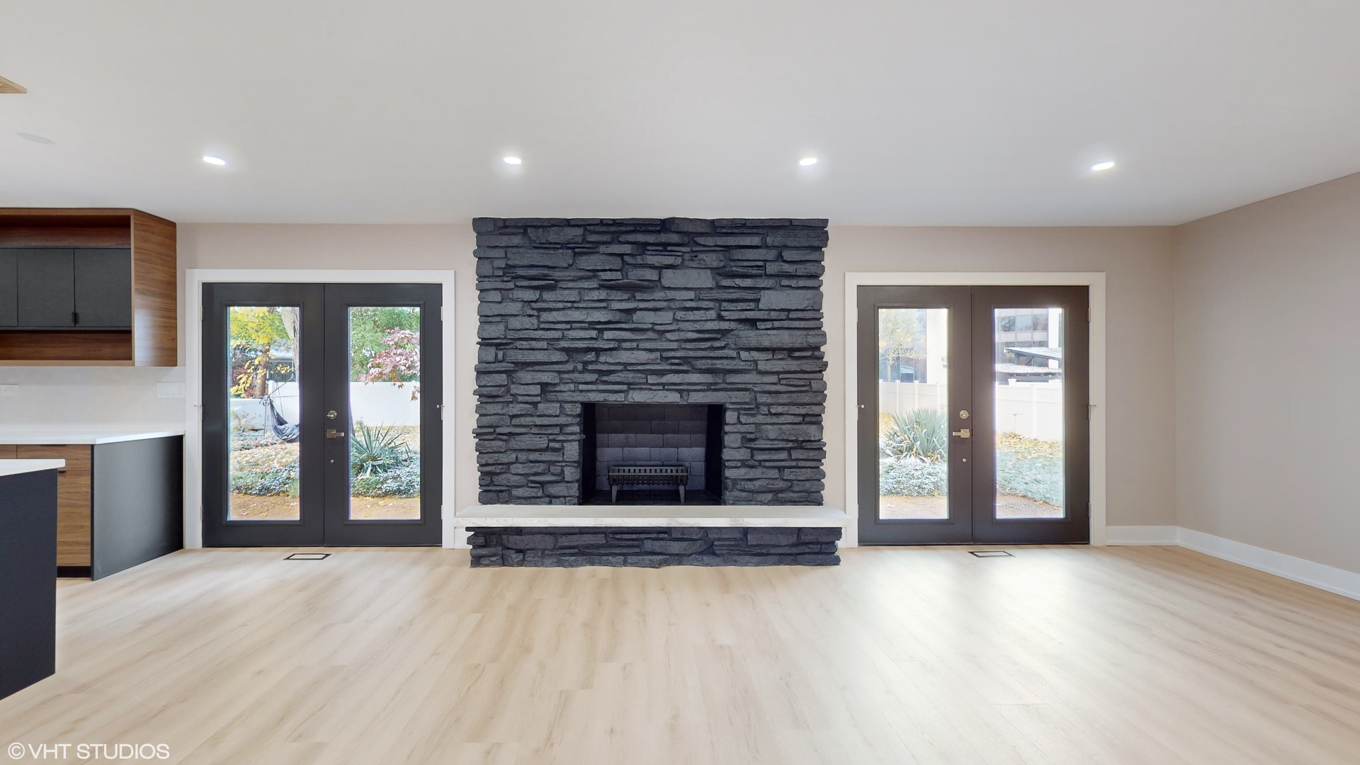 2140 Pfingsten Road Northbrook, IL 60062 - Photo 5 of 44 a view of an empty room with a fireplace and a window