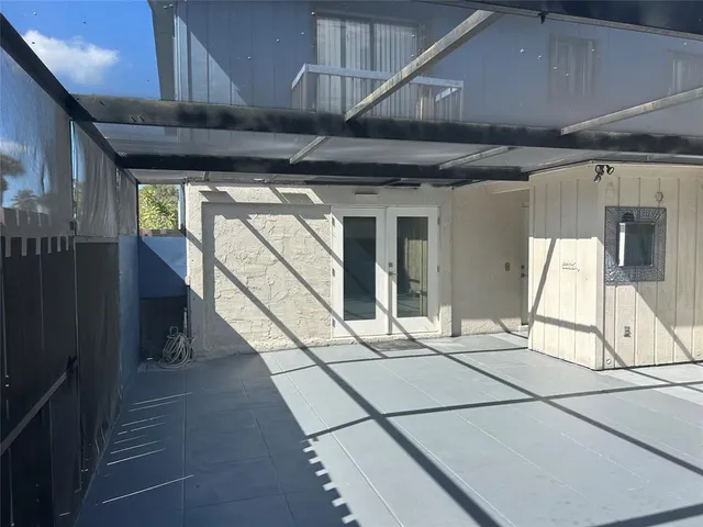 a hallway with front door washer and dryer