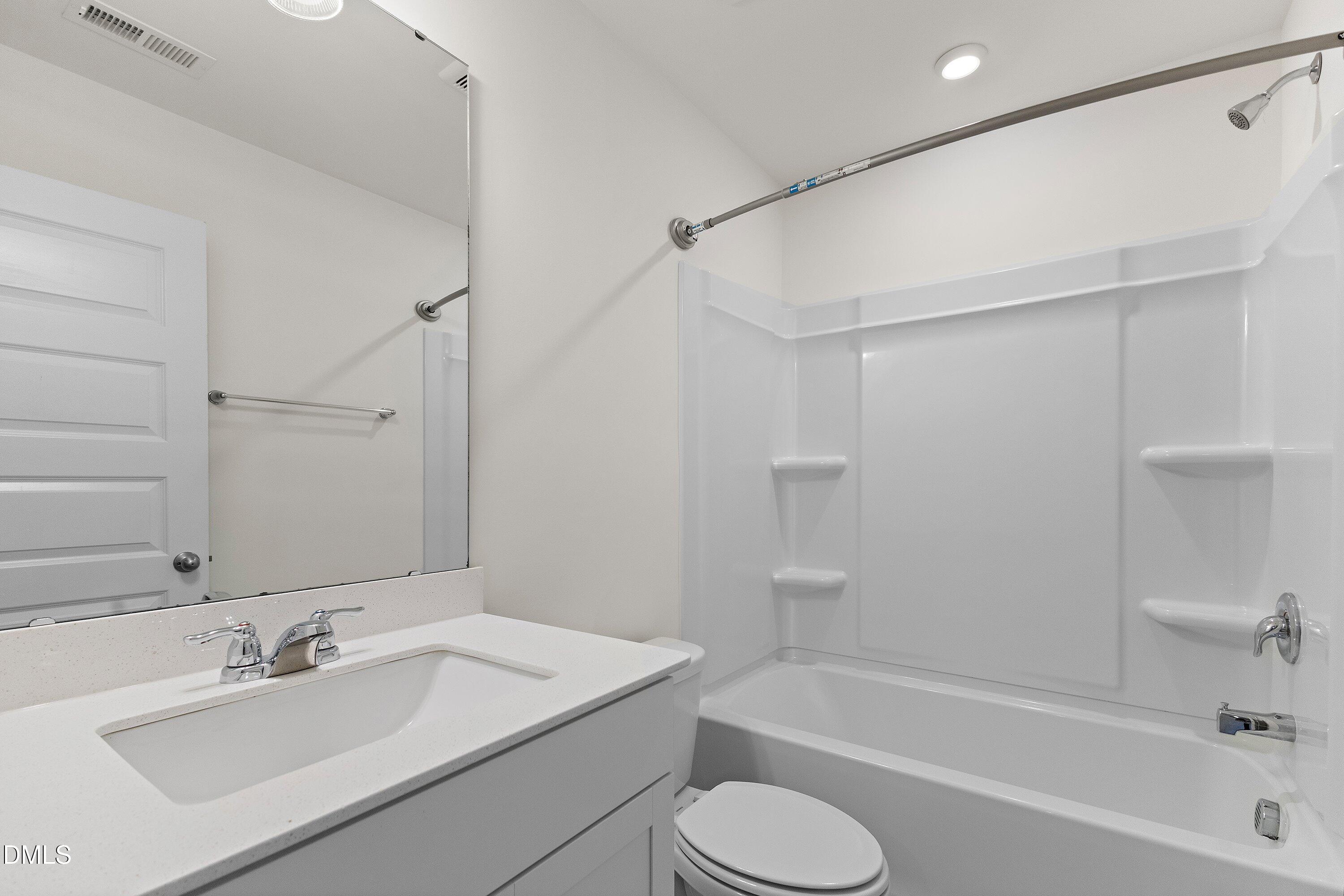 156 Sears Ridge Lane Morrisville, NC 27560 - Photo 34 of 49 a bathroom with a sink toilet bathtub and shower