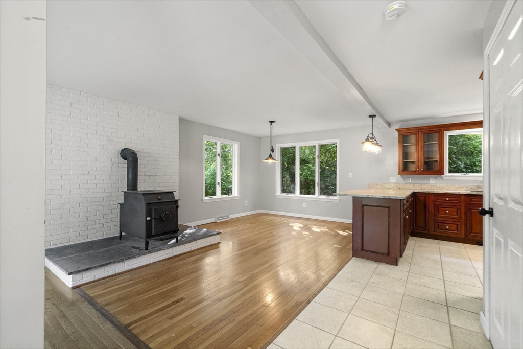 731 R Grove Street Norwell, MA 02061 - Photo 11 of 42 a view of kitchen with granite countertop a sink and a stove top oven
