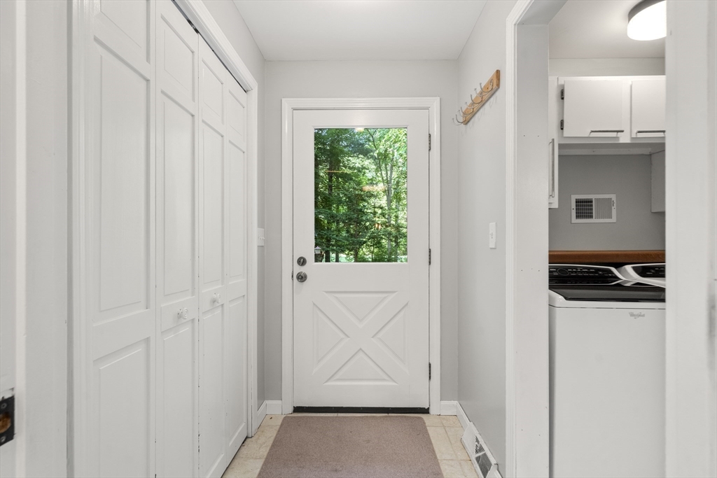 731 R Grove Street Norwell, MA 02061 - Photo 13 of 42 a view of a kitchen from a hallway