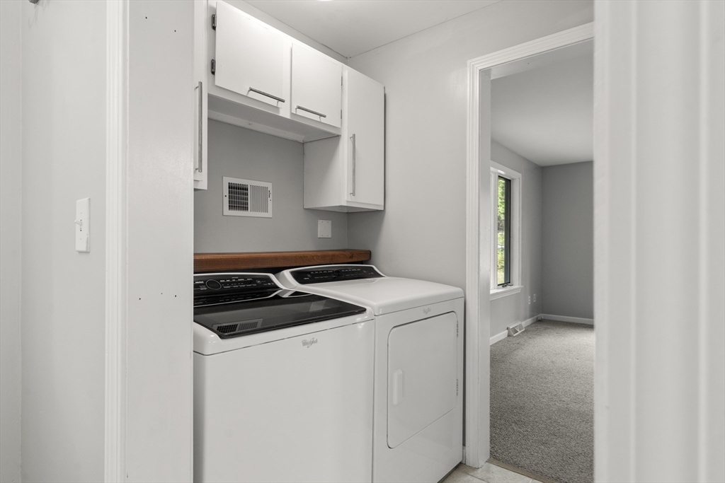 731 R Grove Street Norwell, MA 02061 - Photo 14 of 42 a kitchen that has a sink and a stove