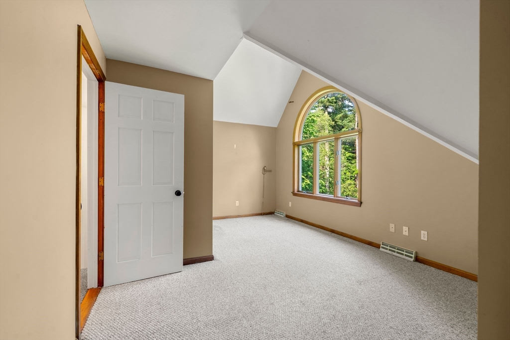 731 R Grove Street Norwell, MA 02061 - Photo 18 of 42 a view of an empty room with a window