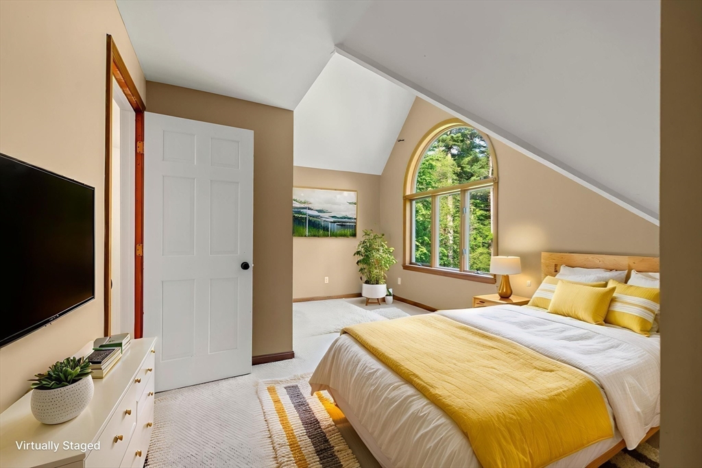 731 R Grove Street Norwell, MA 02061 - Photo 19 of 42 a bedroom with a bed and a large window