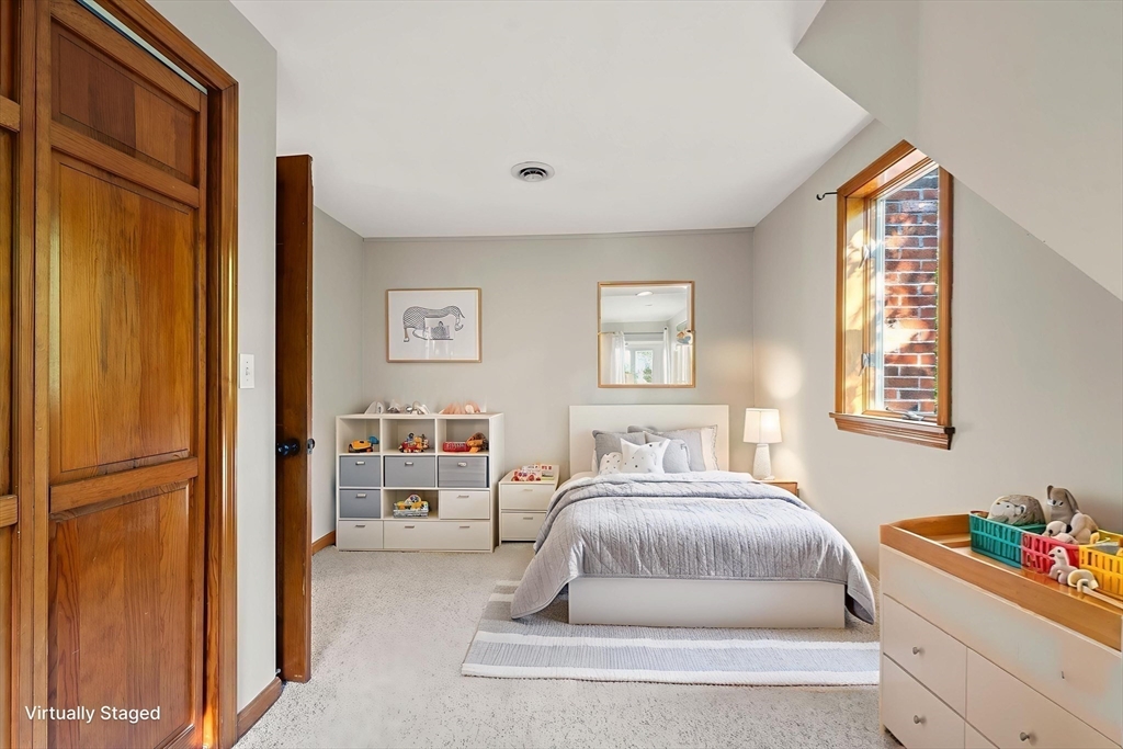 731 R Grove Street Norwell, MA 02061 - Photo 21 of 42 a bedroom with a bed and a window