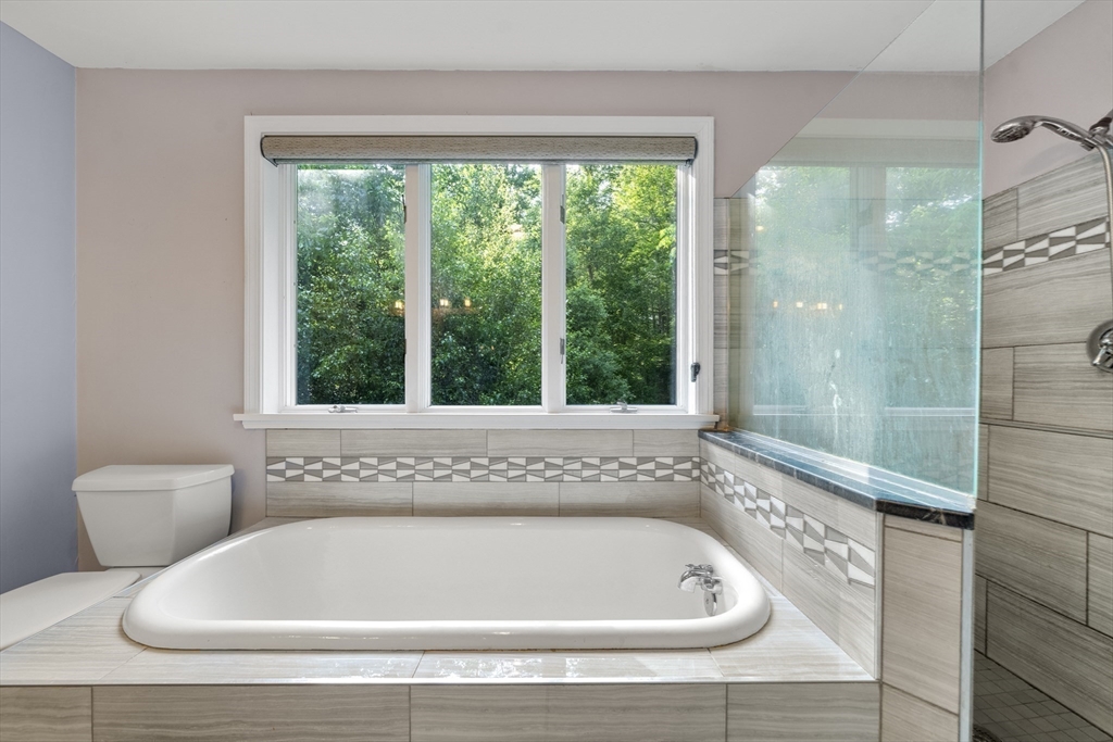 731 R Grove Street Norwell, MA 02061 - Photo 25 of 42 a bath tub sitting next to a window