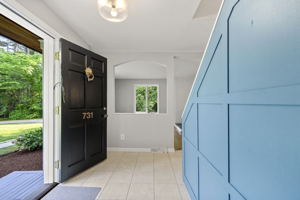 731 R Grove Street Norwell, MA 02061 - Photo 3 of 42 a view of entryway with window and wooden floor